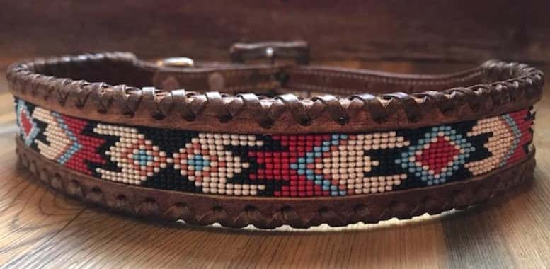 Genuine leather dog collar with red, white, and black navajo beaded inlay design, a leather wrapped edge