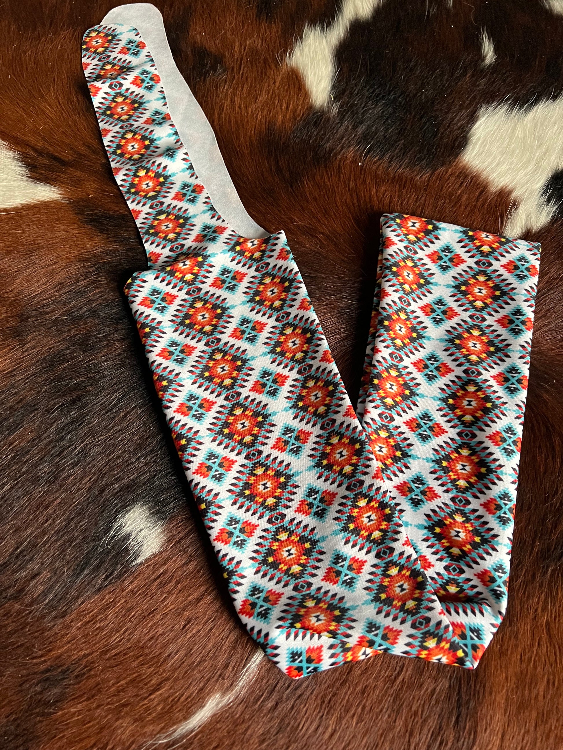 Orange & Teal Aztec Lycra printed slip on tail bag